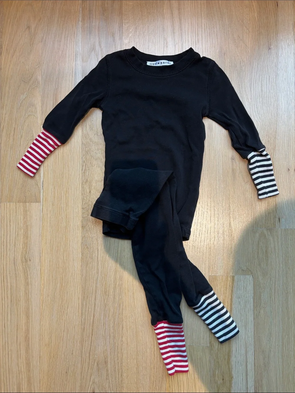 Little Parni Black Kids Two-Piece Pajama Set with Red & Black Stripe Accents